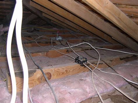 dark colored insulation around electrical boxes in attic|attic junction box insulation requirements.